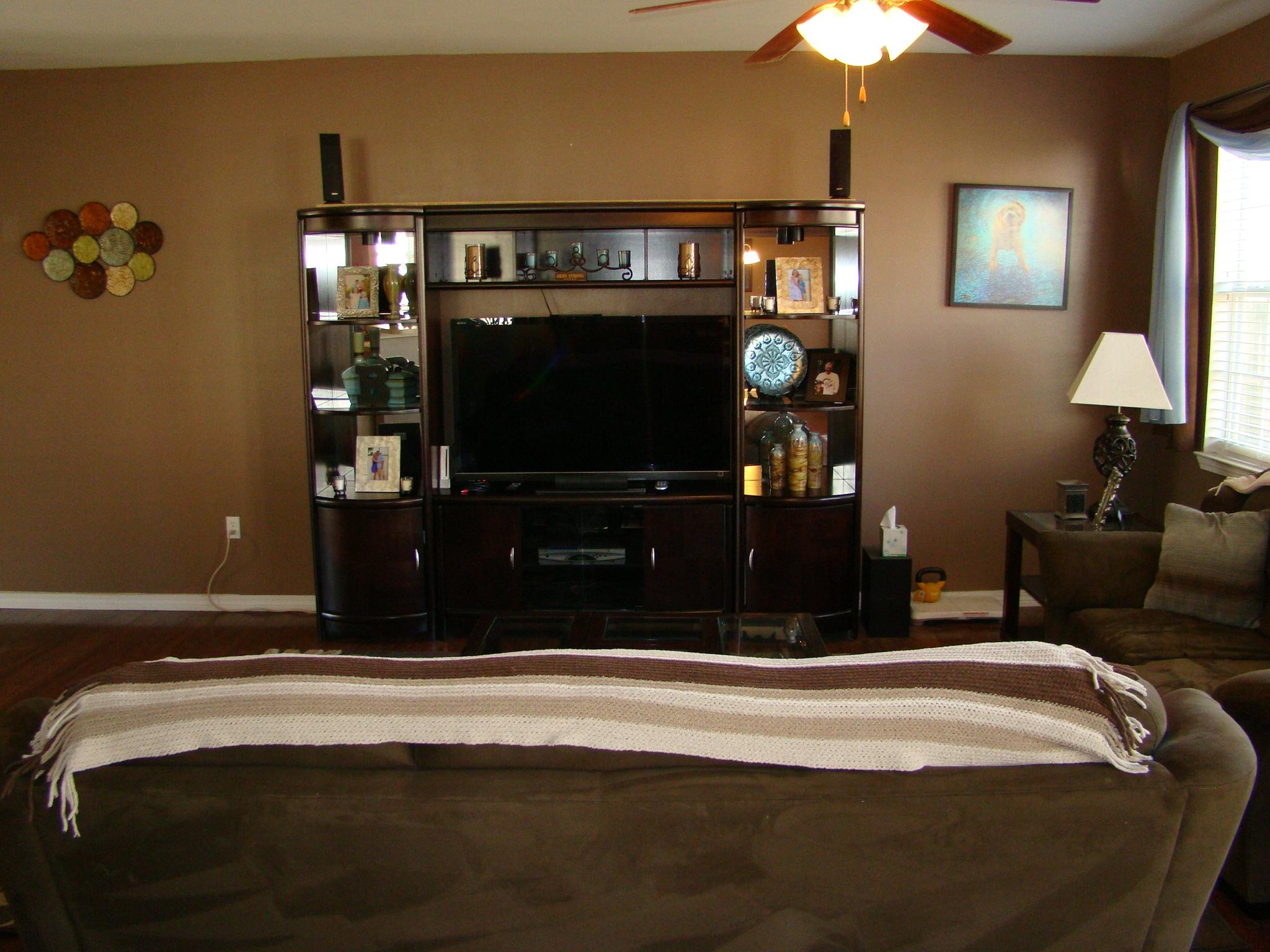 607 Prairie Street Crestview, FL 32536 - Photo 9 of 43 a bedroom with a bed and a flat tv screen on dresser