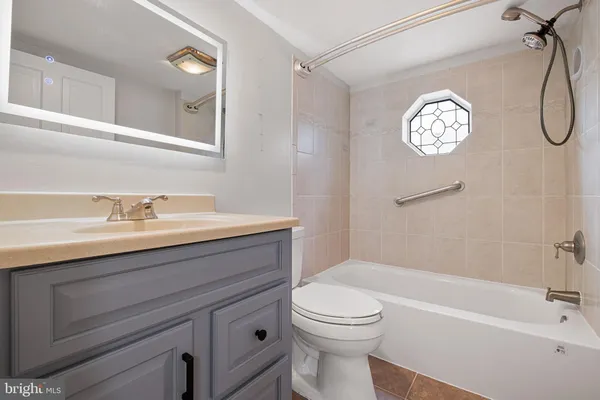 a bathroom with a sink a toilet and a bathtub