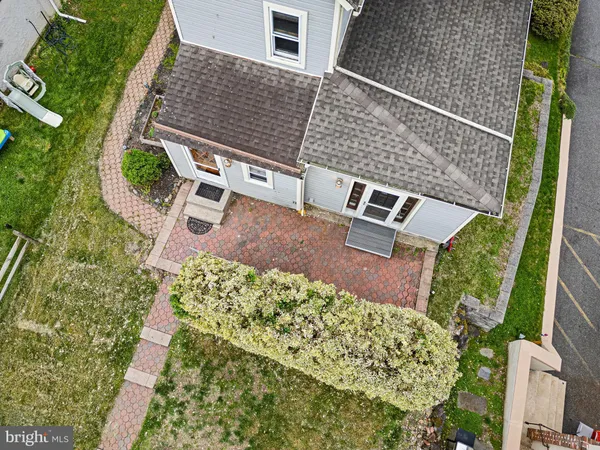 aerial view of a house with a yard