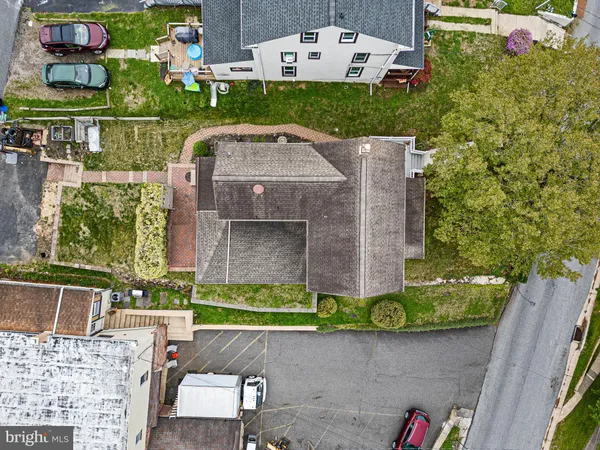 an aerial view of a house with a garden