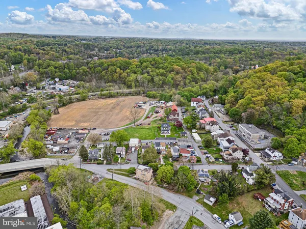 an aerial view of residential houses with outdoor space