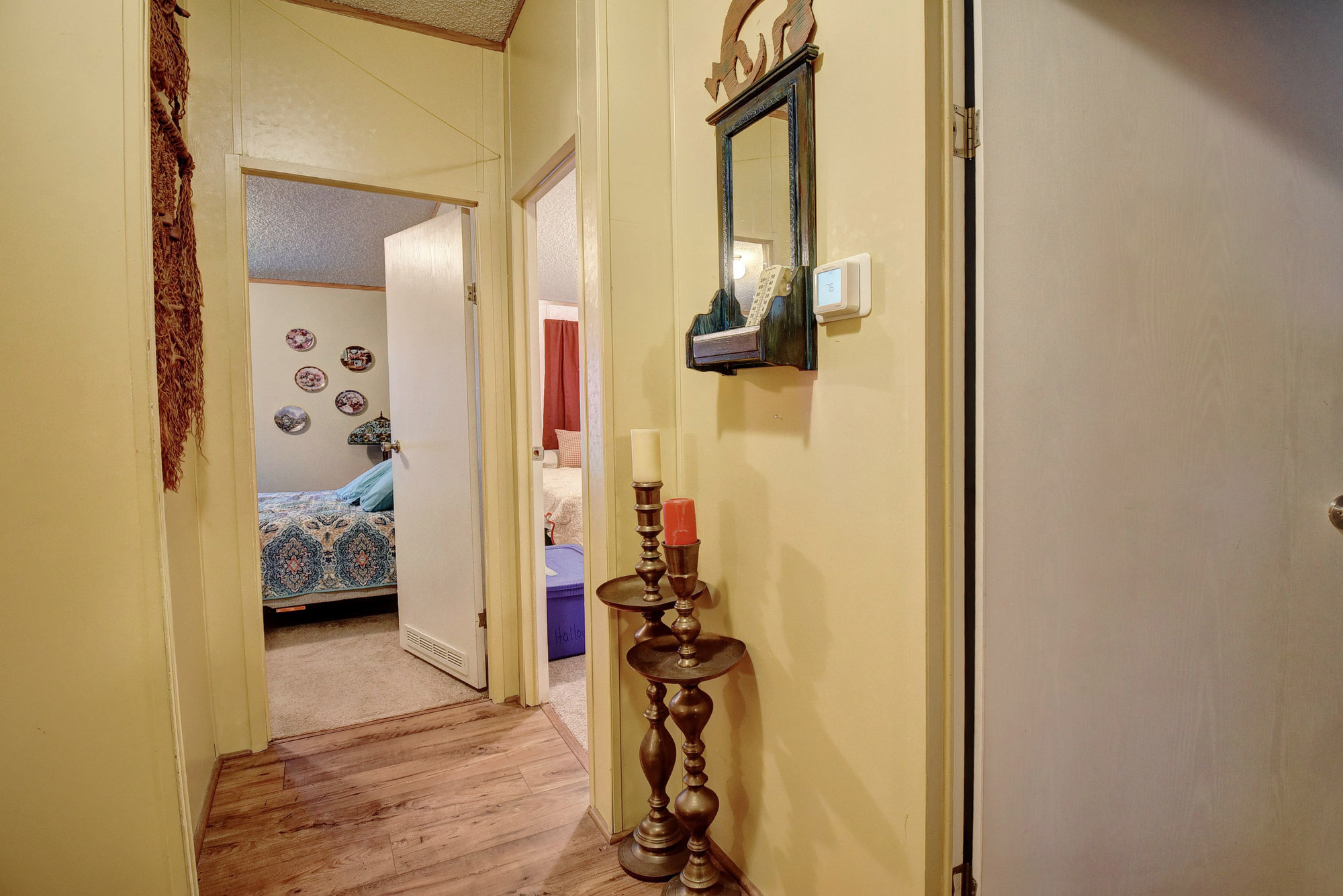 181 Lockwood Road Red Rock, TX 78662 - Photo 20 of 32 a view of a hallway with wooden floor and stairs