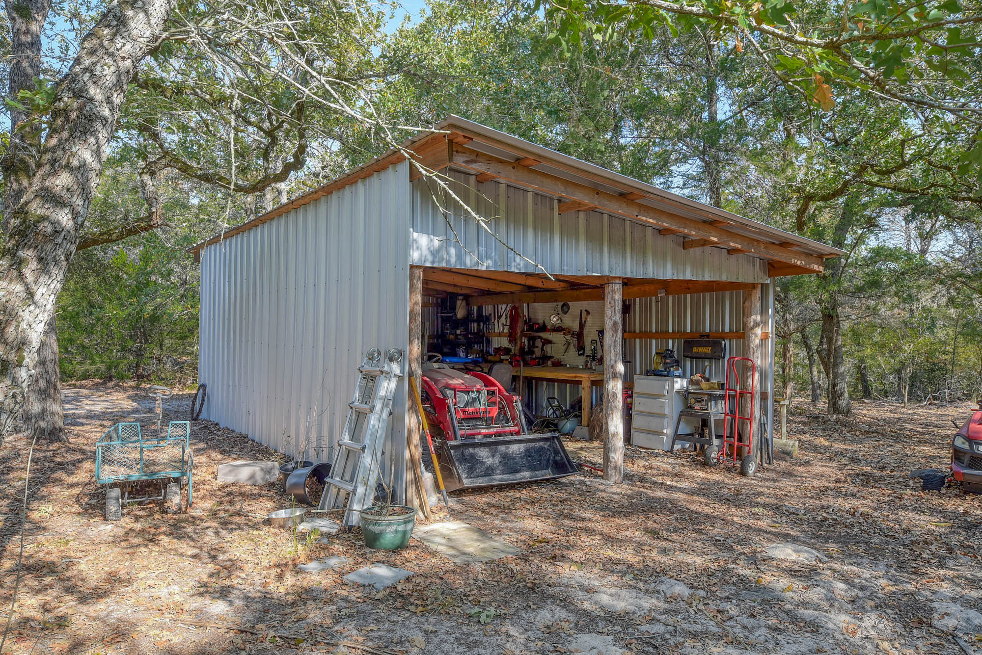 181 Lockwood Road Red Rock, TX 78662 - Photo 28 of 32 a view of a house with a backyard and chairs