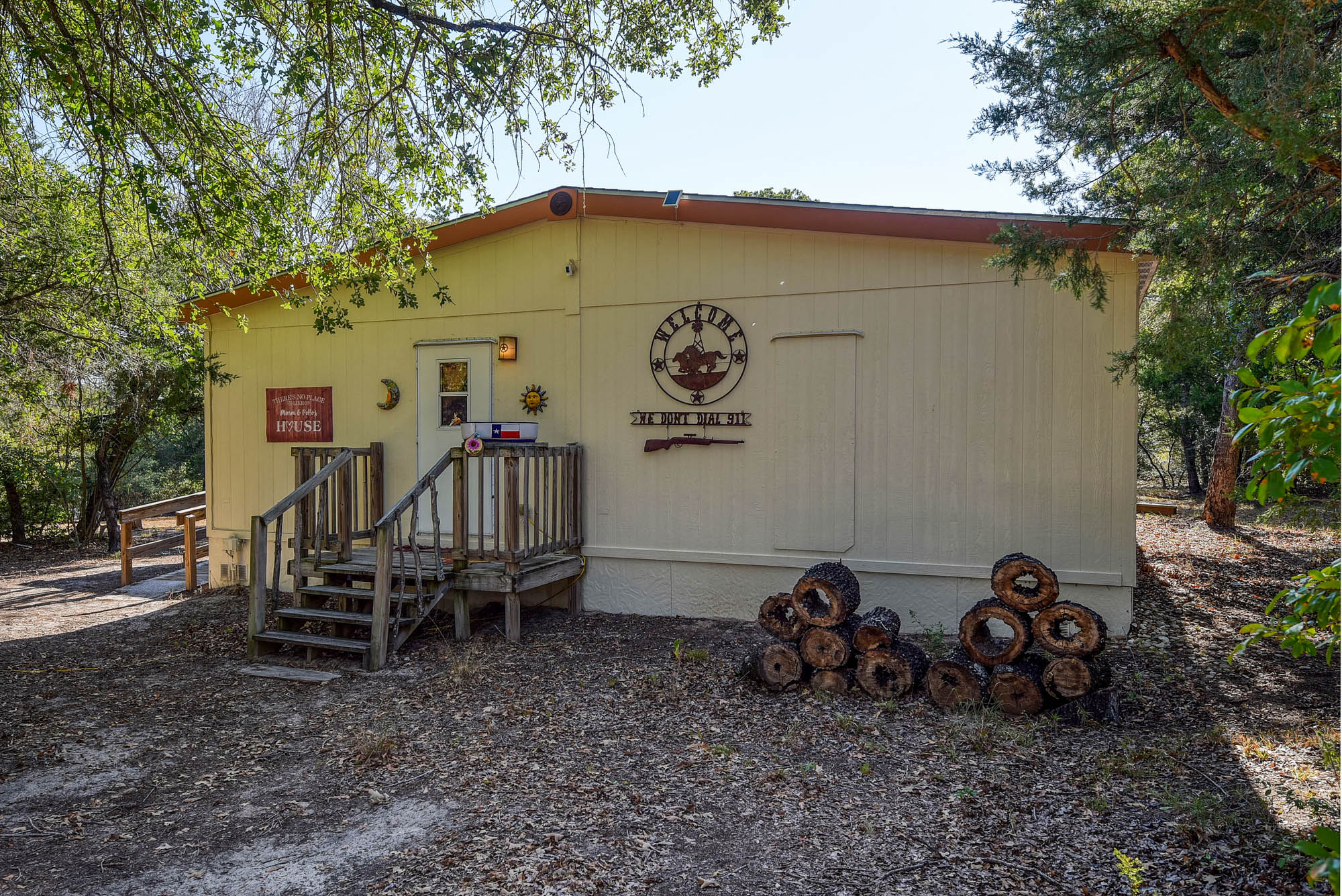 181 Lockwood Road Red Rock, TX 78662 - Photo 3 of 32 a view of a chairs and table in the backyard