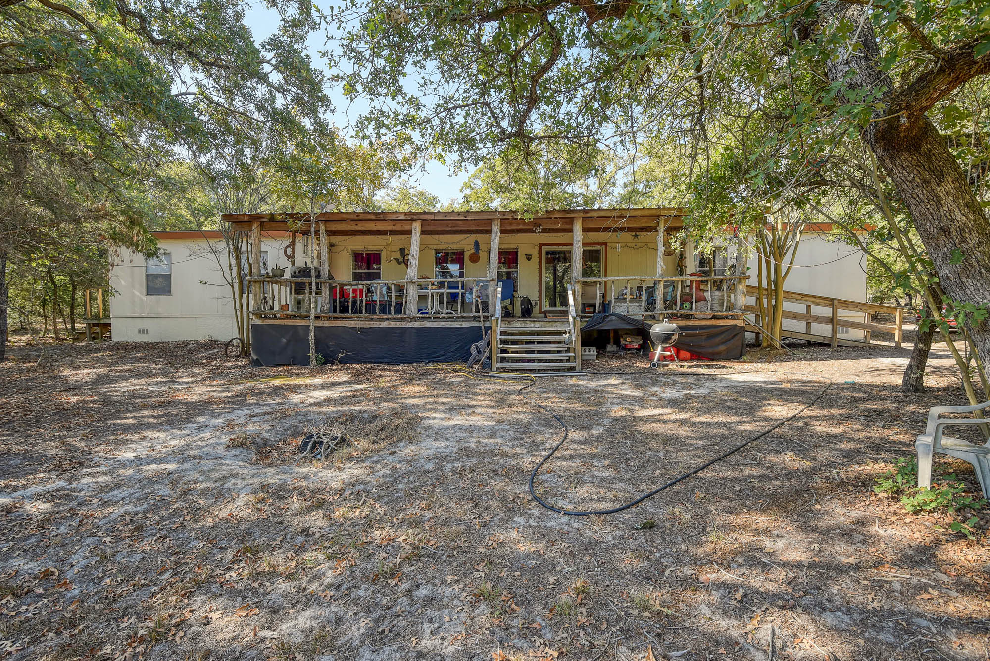 181 Lockwood Road Red Rock, TX 78662 - Photo 4 of 32 front view of a house with a patio