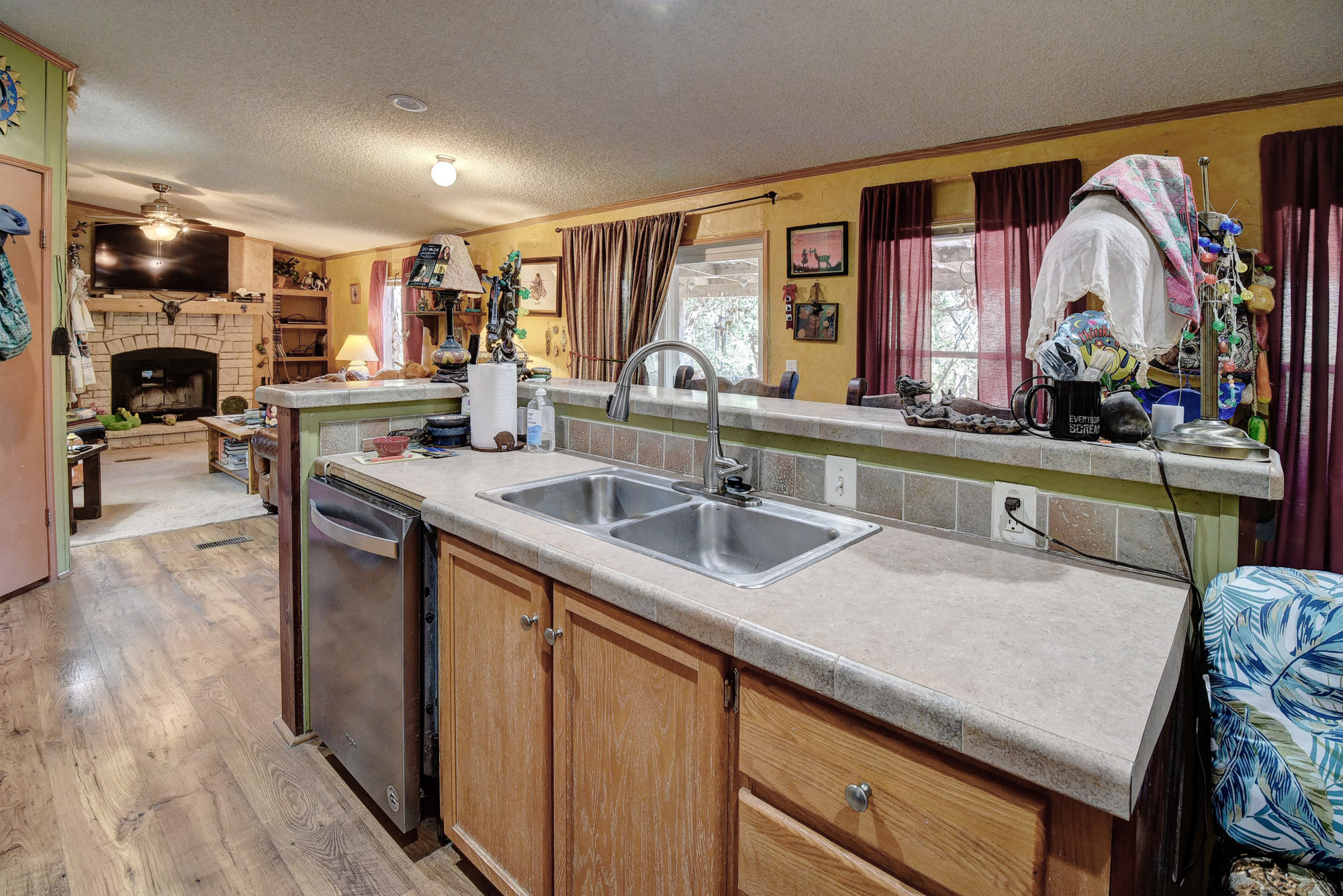 181 Lockwood Road Red Rock, TX 78662 - Photo 10 of 32 a kitchen with stainless steel appliances granite countertop a sink and a stove