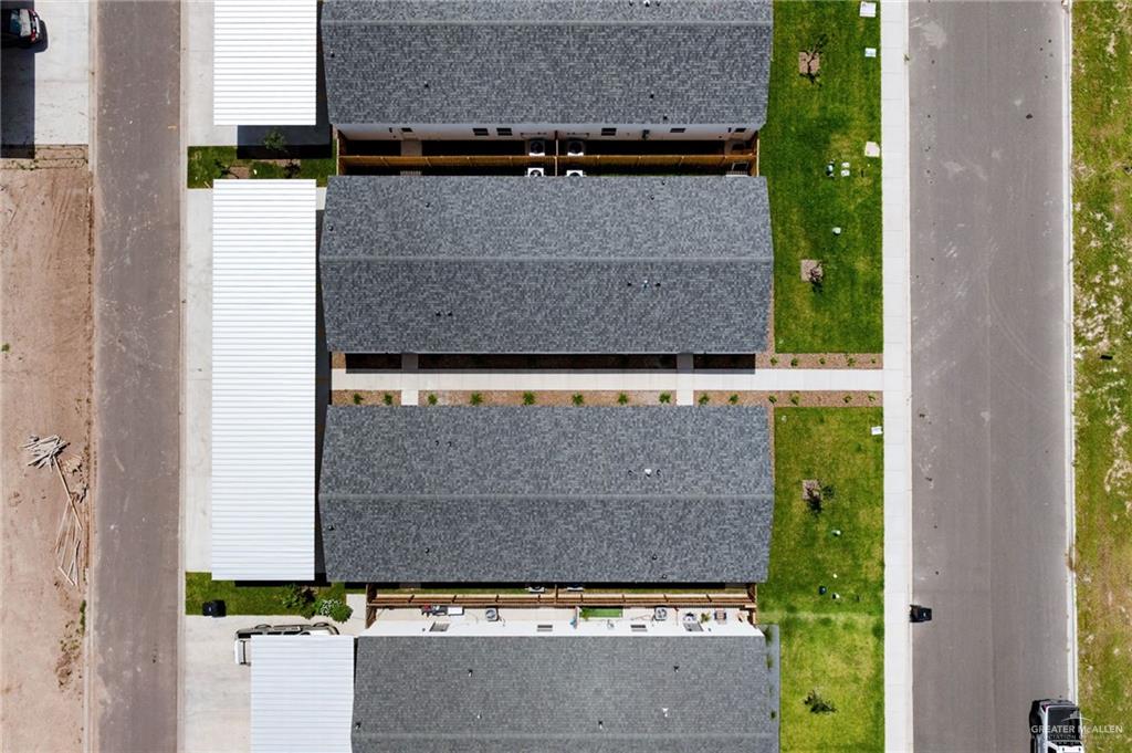 2701 Woodpecker Road, Unit 1 Weslaco, TX 78596 - Photo 15 of 18 an aerial view of a house with a yard and a garage