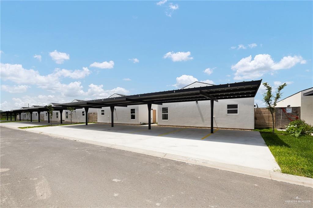 2701 Woodpecker Road, Unit 1 Weslaco, TX 78596 - Photo 16 of 18 a big house with a yard and garage
