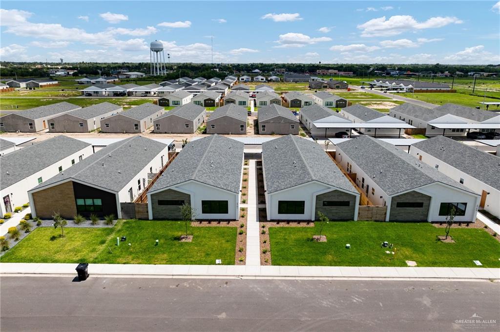 2701 Woodpecker Road, Unit 1 Weslaco, TX 78596 - Photo 2 of 18 a front view of a house with garden and patio