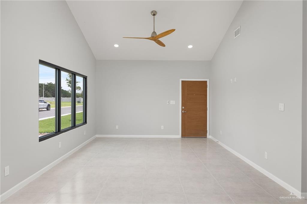 2701 Woodpecker Road, Unit 1 Weslaco, TX 78596 - Photo 4 of 18 a view of an empty room with a window