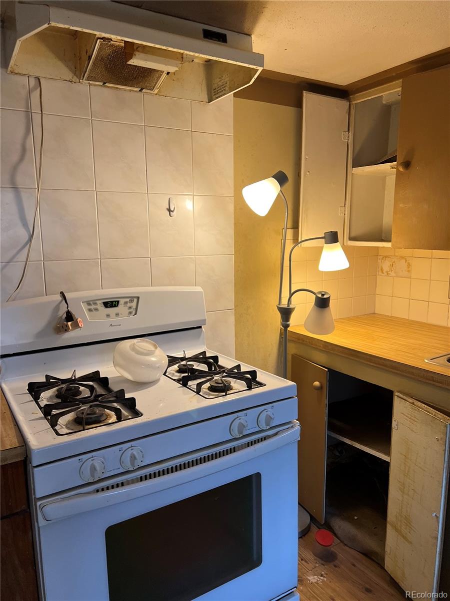a kitchen with a stove and a sink