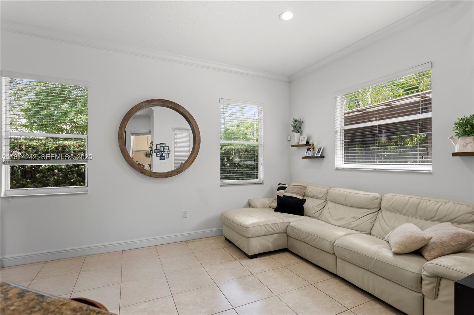 9339 Southwest 98th Place Miami, FL 33176 - Photo 16 of 33 a living room with furniture and a window