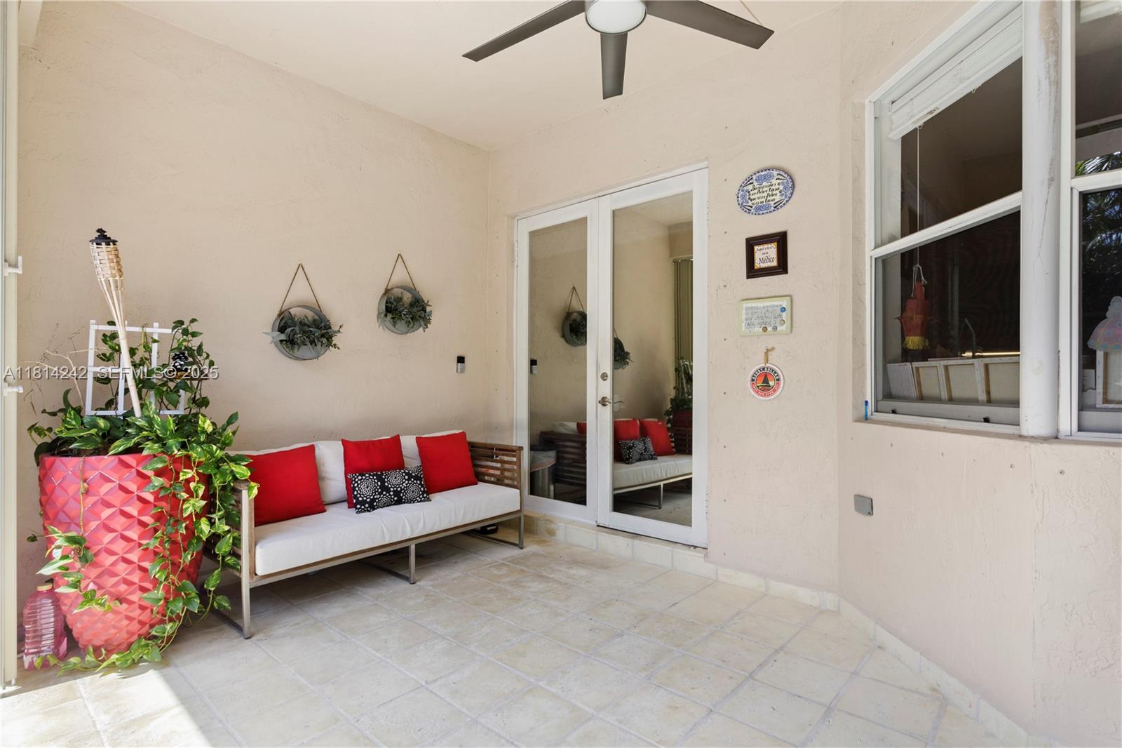 9339 Southwest 98th Place Miami, FL 33176 - Photo 17 of 33 a living room with furniture and flowers