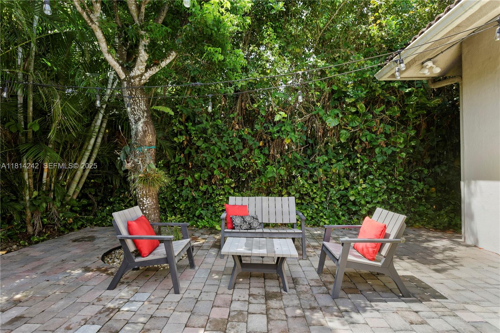 9339 Southwest 98th Place Miami, FL 33176 - Photo 18 of 33 a backyard of a house with outdoor seating