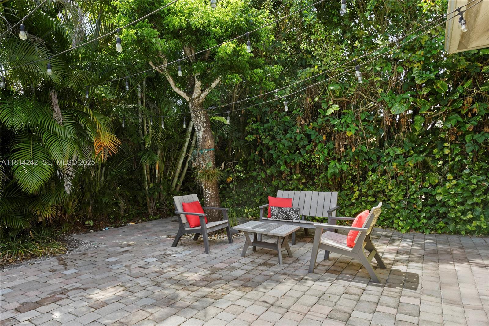 9339 Southwest 98th Place Miami, FL 33176 - Photo 19 of 33 a backyard view with sitting space and garden