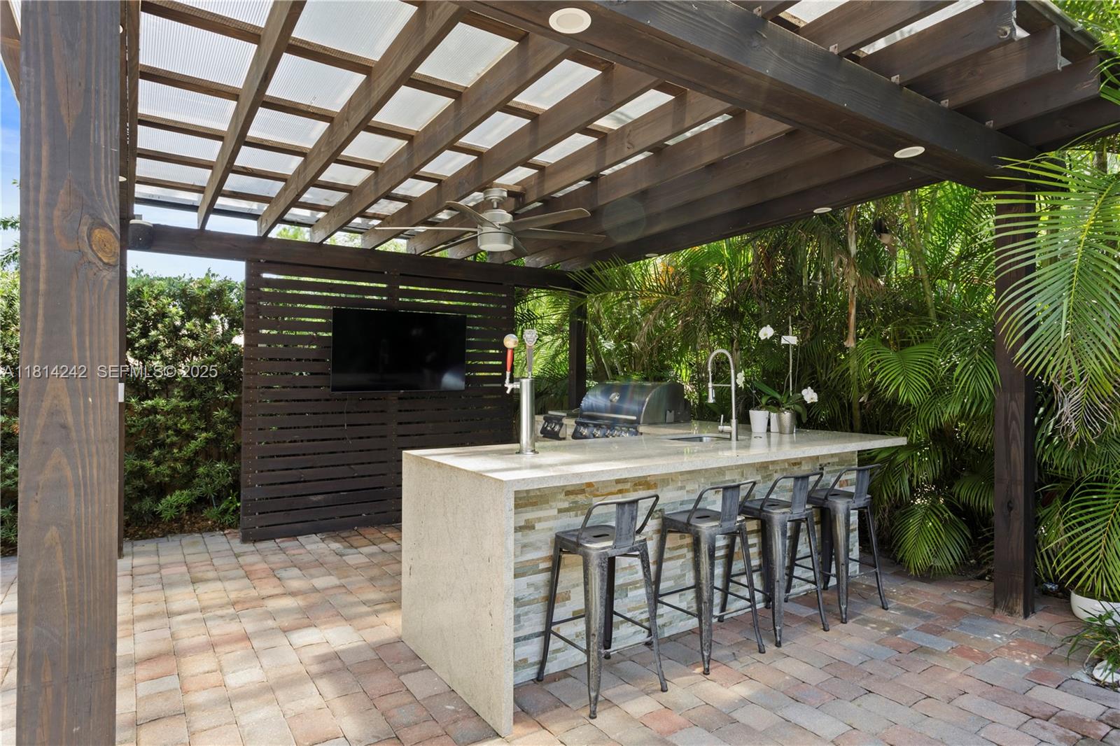 9339 Southwest 98th Place Miami, FL 33176 - Photo 22 of 33 a table and chairs in front of a house