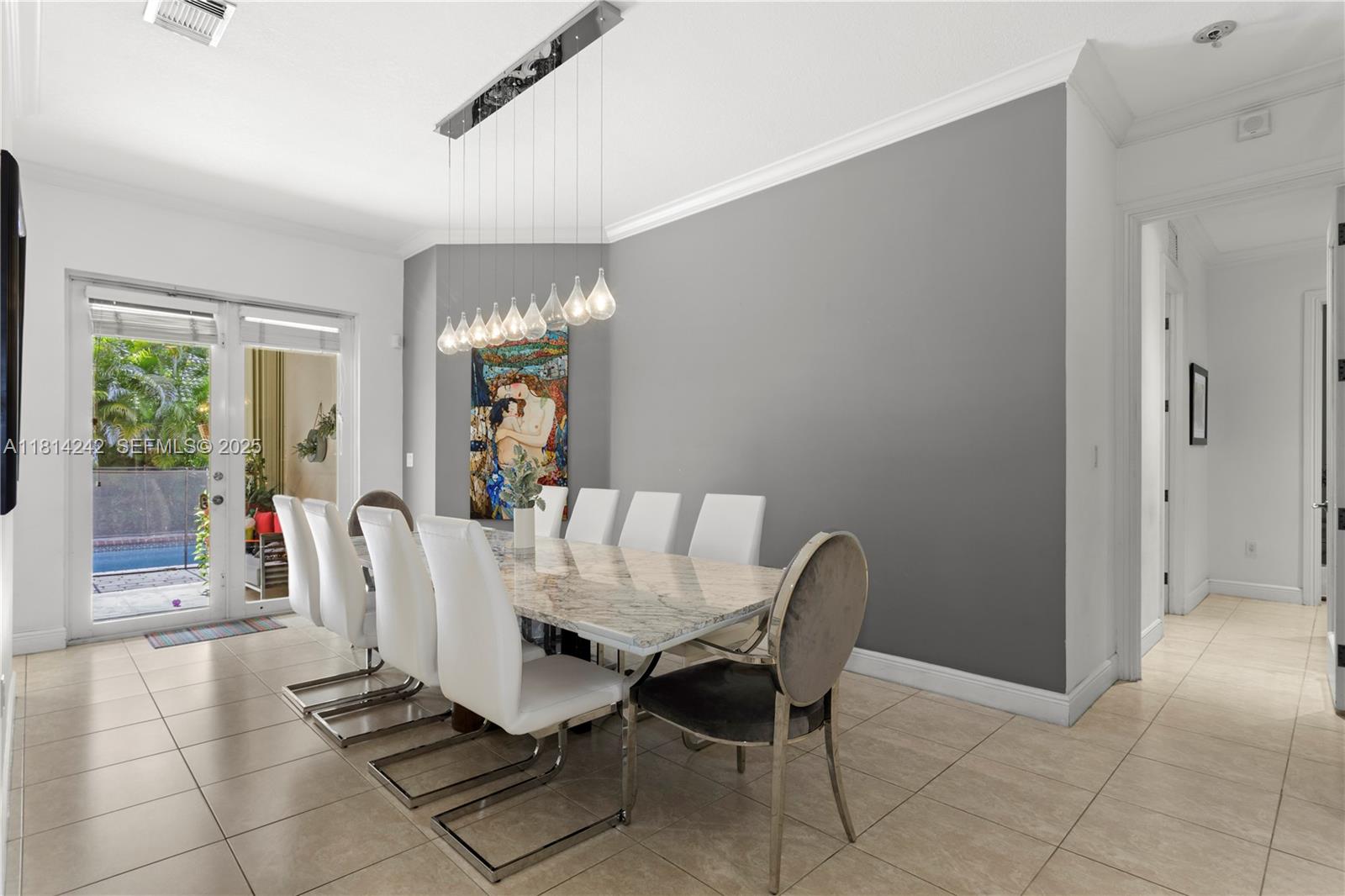 9339 Southwest 98th Place Miami, FL 33176 - Photo 8 of 33 a view of a dining room with furniture and a chandelier