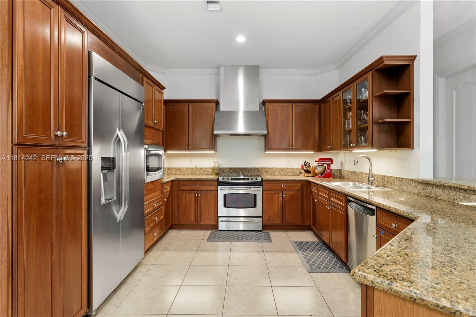 9339 Southwest 98th Place Miami, FL 33176 - Photo 10 of 33 a kitchen with stainless steel appliances granite countertop a refrigerator and a sink