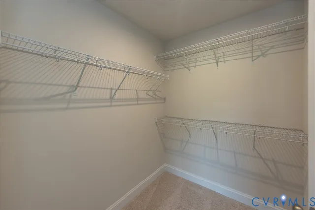 a view of an empty room and a window