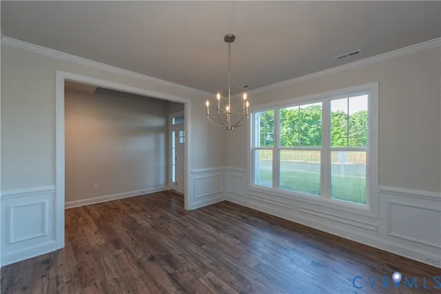 a view of livingroom with window and hardwood floor