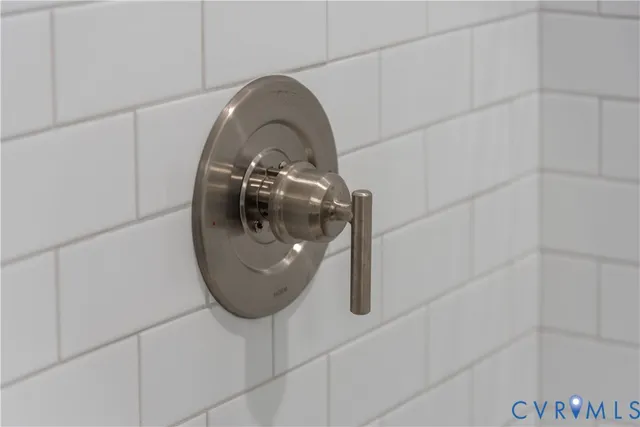 a bathroom with a shower and a sink