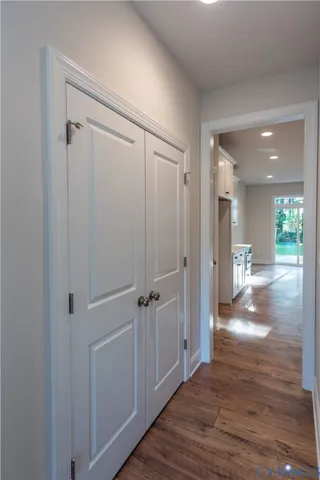 a view of a hallway with wooden floor
