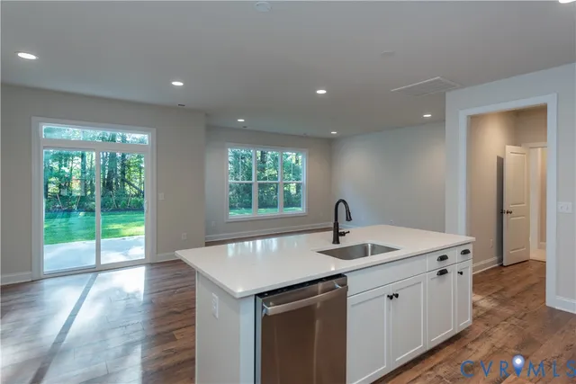 a kitchen with a sink and large window