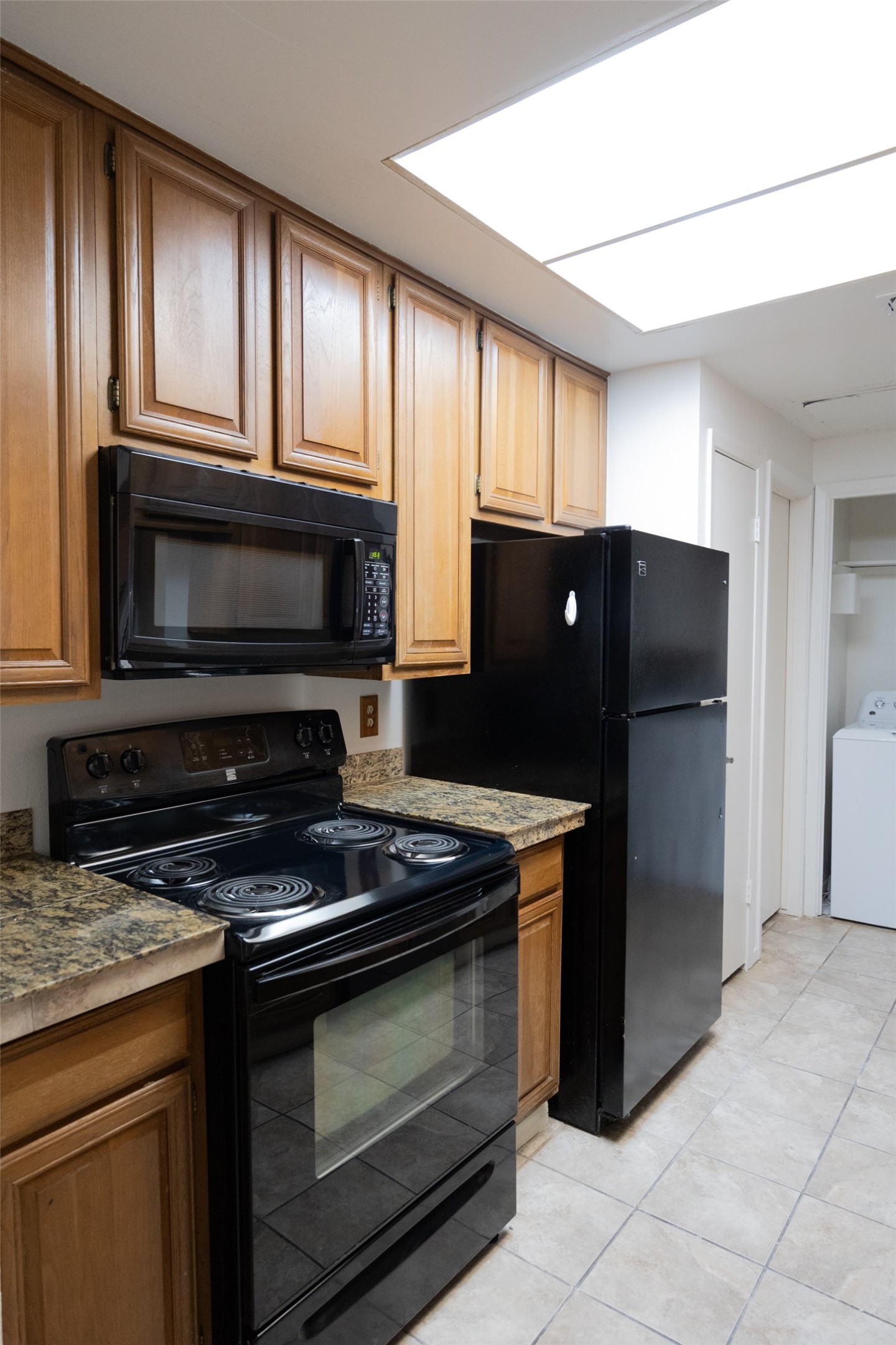 806 West 24th Street, Unit 207 Austin, TX 78705 - Photo 1 of 8 a kitchen with granite countertop cabinets and steel stainless steel appliances
