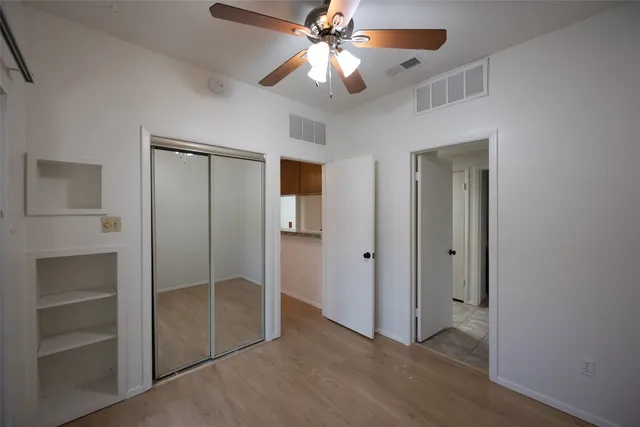 a view of an empty room with a bathroom