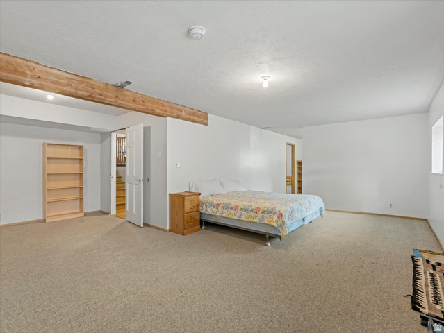 2228 East Renegade Road Sandy, UT 84093 - Photo 19 of 35 Spacious room featuring neutral carpeting and white walls