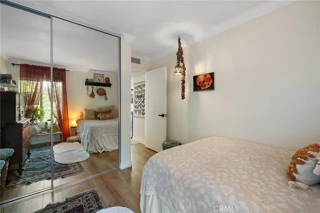 a bedroom with bed and a window