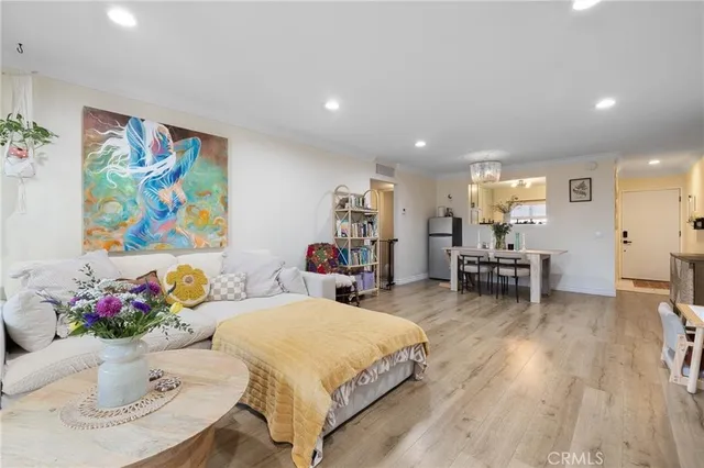 a living room with furniture and flowers