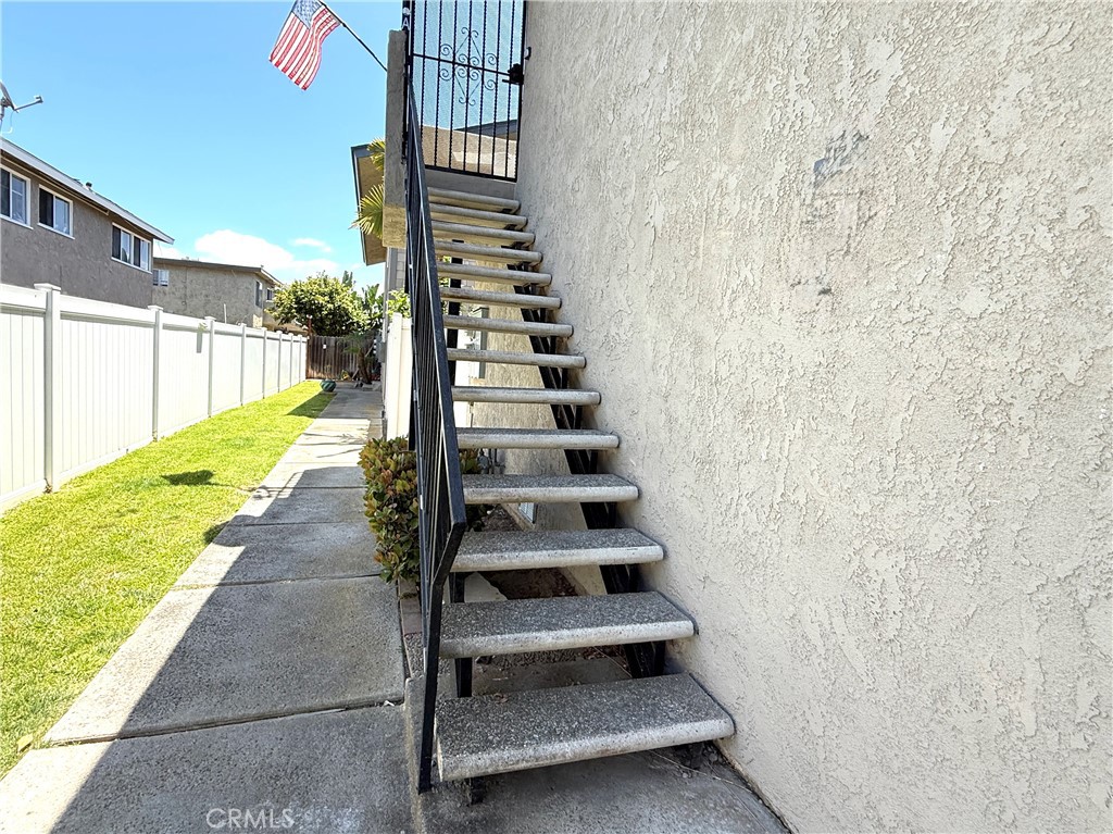 16752 Sims Lane, Unit A Huntington Beach, CA 92649 - Photo 8 of 8 a view of staircase with white walls