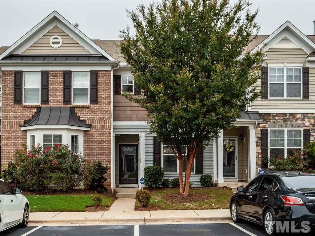 6621 Morgantown Street Raleigh, NC 27616 - Photo 1 of 25 a view of a brick house with a clock tower in front of it