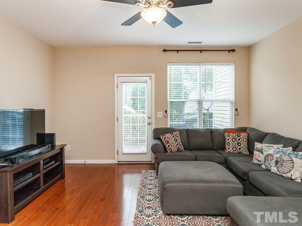 6621 Morgantown Street Raleigh, NC 27616 - Photo 11 of 25 a living room with furniture and a flat screen tv