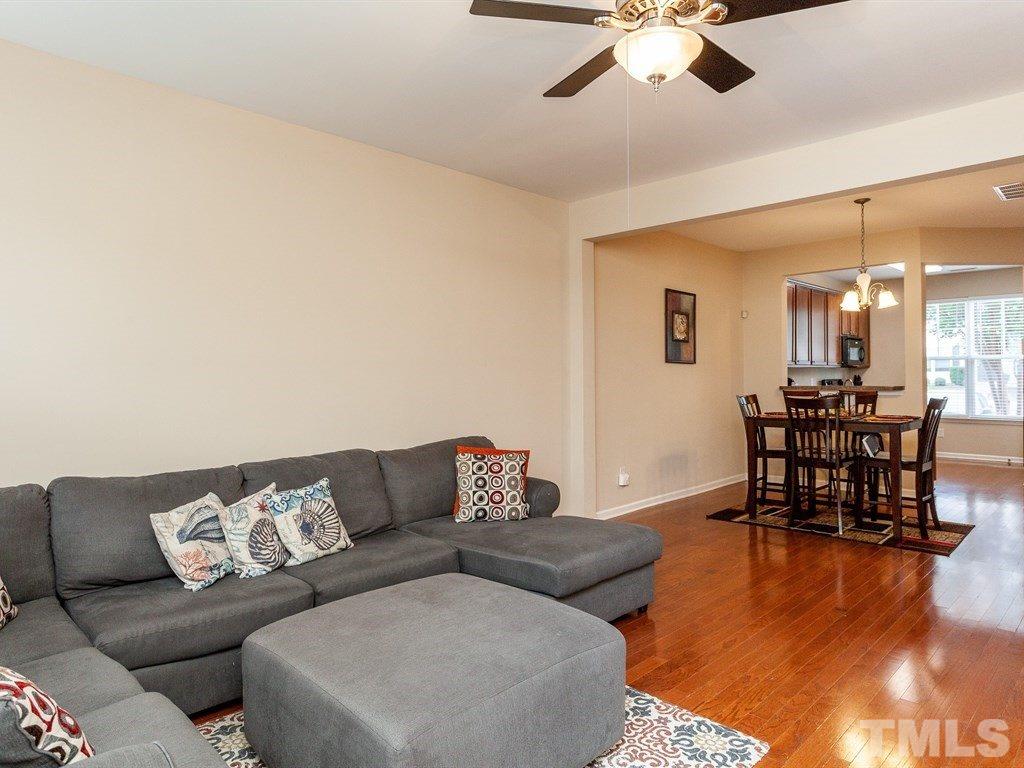 6621 Morgantown Street Raleigh, NC 27616 - Photo 12 of 25 a living room with furniture and a large window