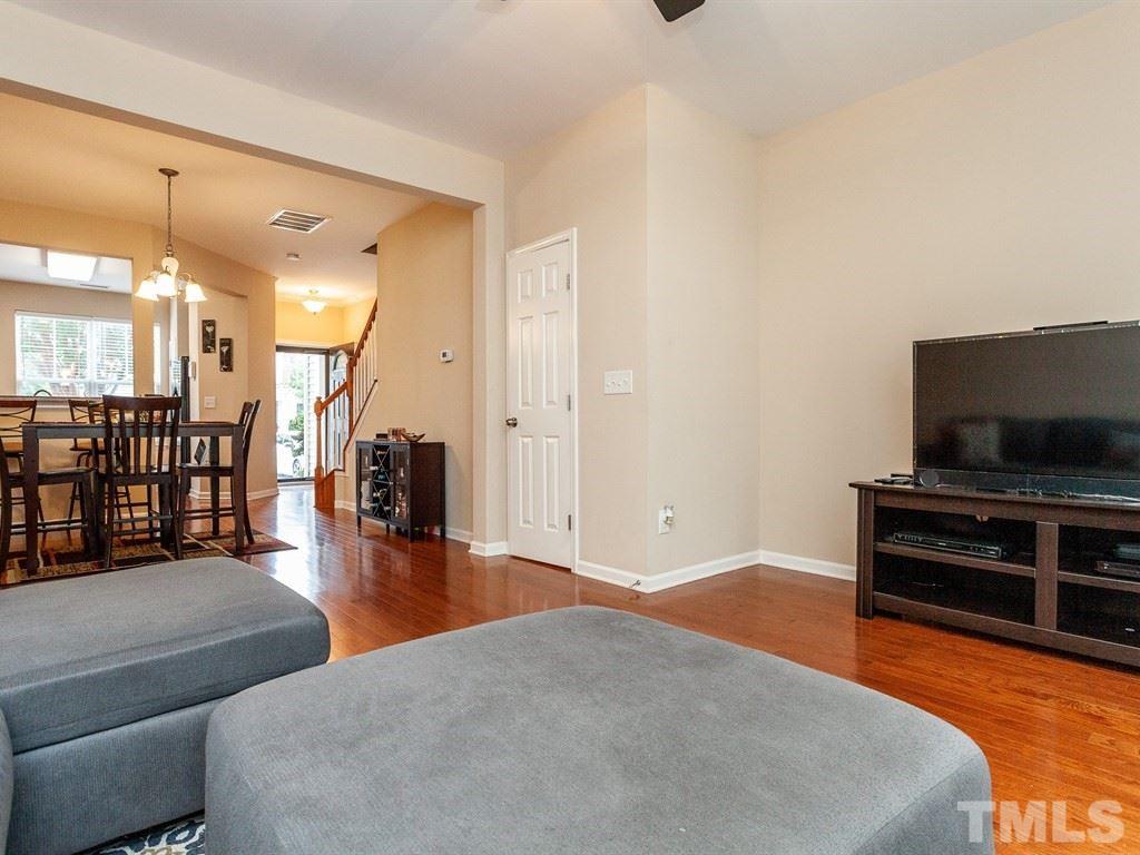 6621 Morgantown Street Raleigh, NC 27616 - Photo 14 of 25 a living room with furniture and a flat screen tv
