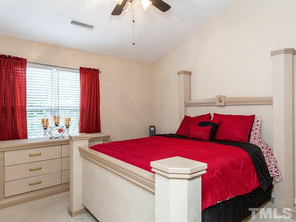 6621 Morgantown Street Raleigh, NC 27616 - Photo 18 of 25 a room with a bed and a window