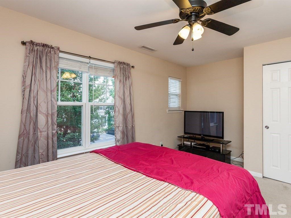 6621 Morgantown Street Raleigh, NC 27616 - Photo 21 of 25 a bedroom with a bed and a flat screen tv
