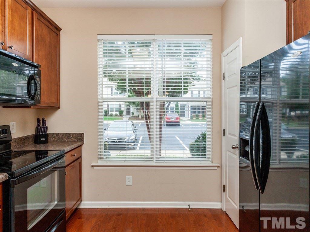6621 Morgantown Street Raleigh, NC 27616 - Photo 5 of 25 a view of kitchen with stainless steel appliances wooden floor sink and a window