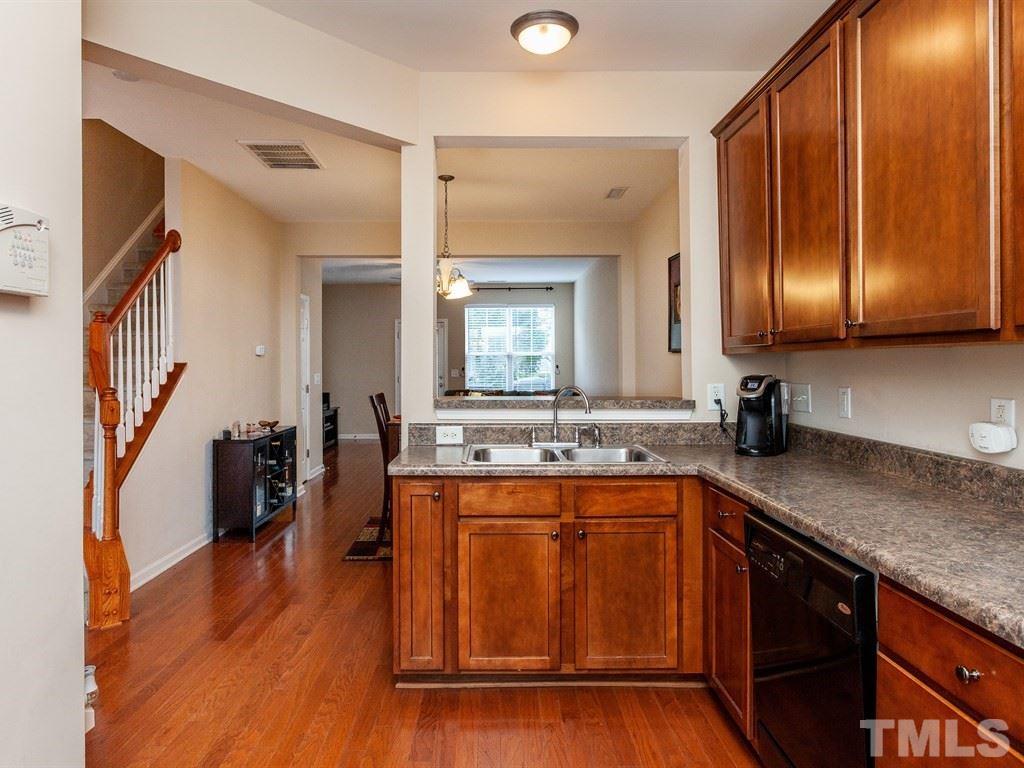 6621 Morgantown Street Raleigh, NC 27616 - Photo 6 of 25 a kitchen with a sink and cabinets