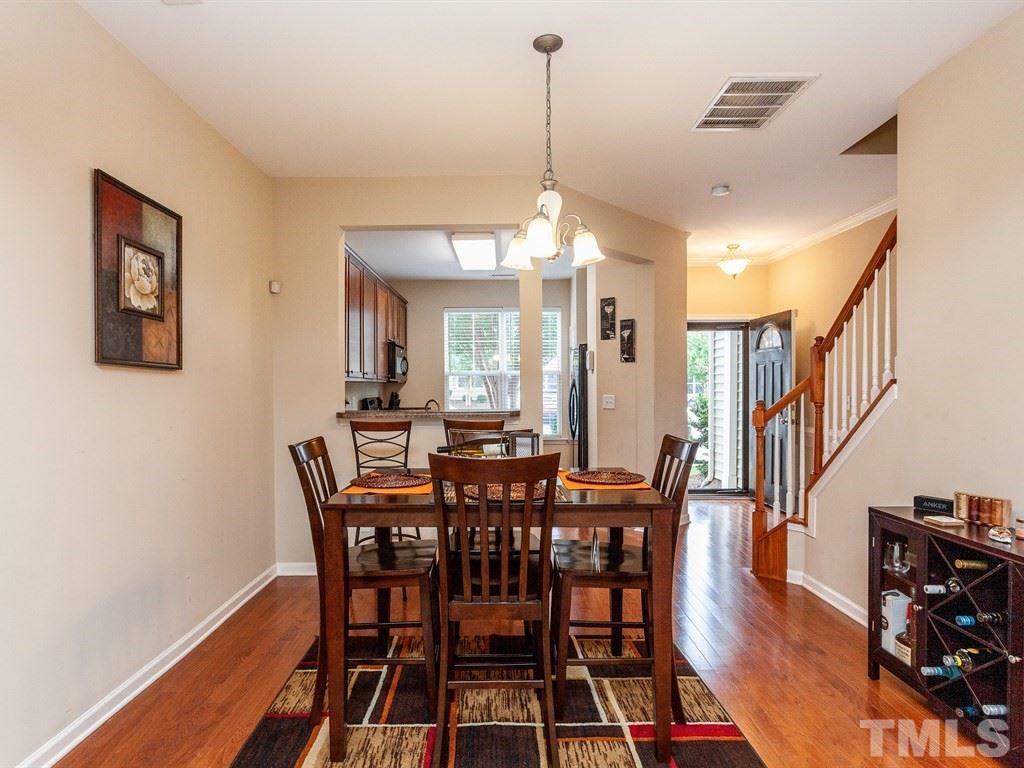 6621 Morgantown Street Raleigh, NC 27616 - Photo 9 of 25 a view of a a dining room with furniture window and wooden floor