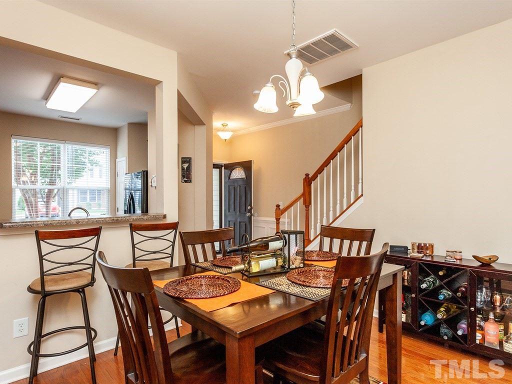 6621 Morgantown Street Raleigh, NC 27616 - Photo 10 of 25 a view of a dining room with furniture and a chandelier