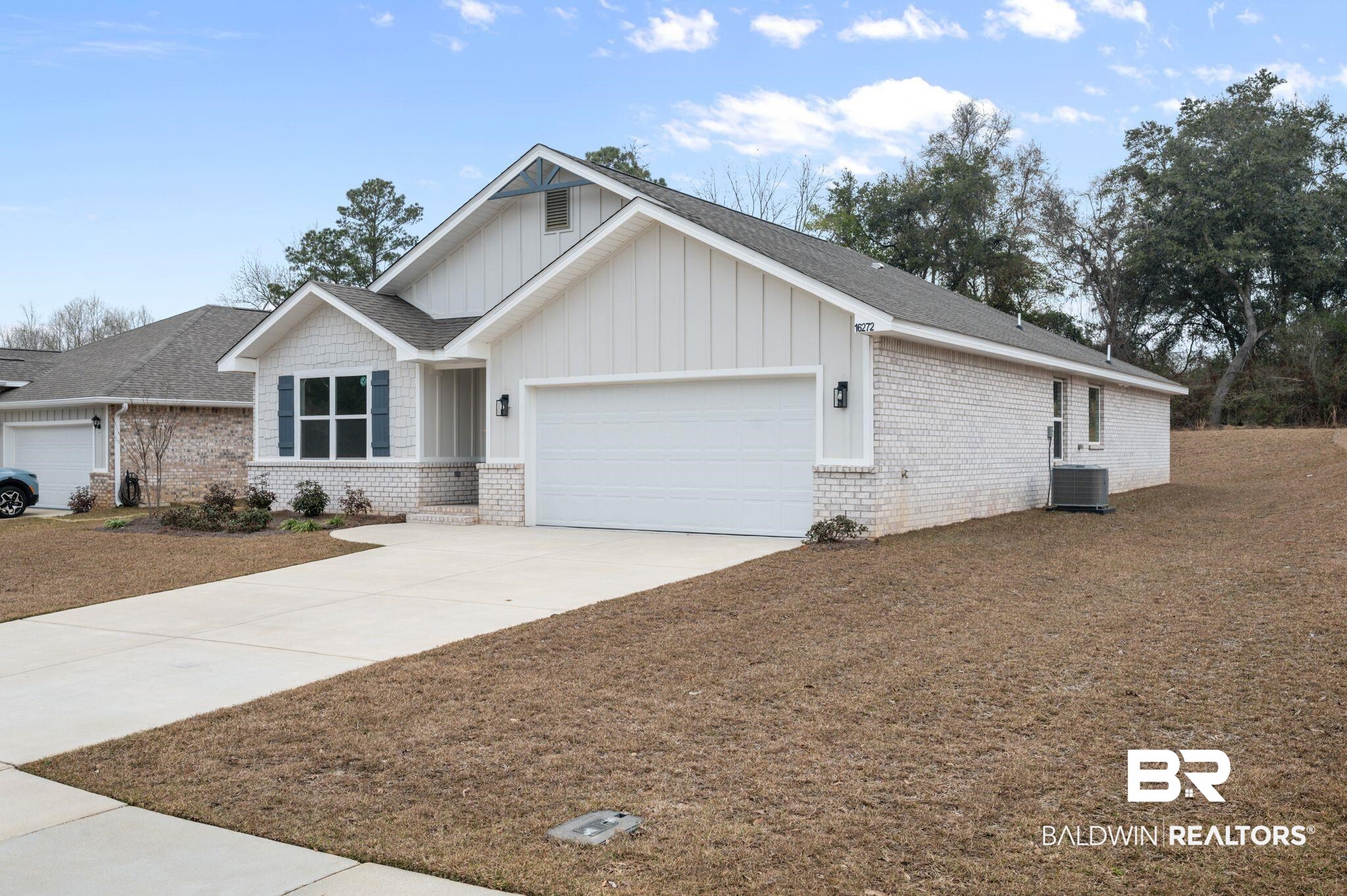 16272 Laurelbrooke Loop Fairhope, AL 36532 - Photo 6 of 40 View of front of home featuring a garage and central air condition unit