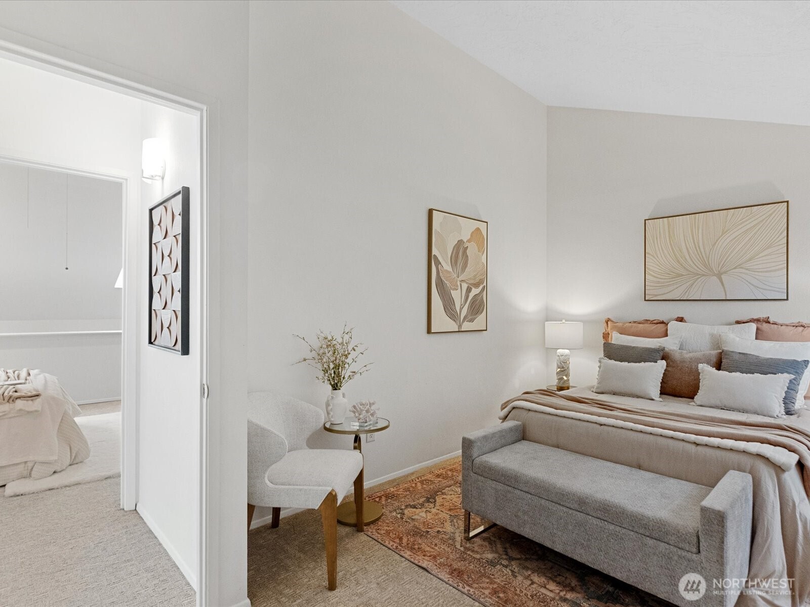 3506 108th Place Northeast, Unit 2 Bellevue, WA 98004 - Photo 22 of 39 a bedroom with a bed and a painting on the wall