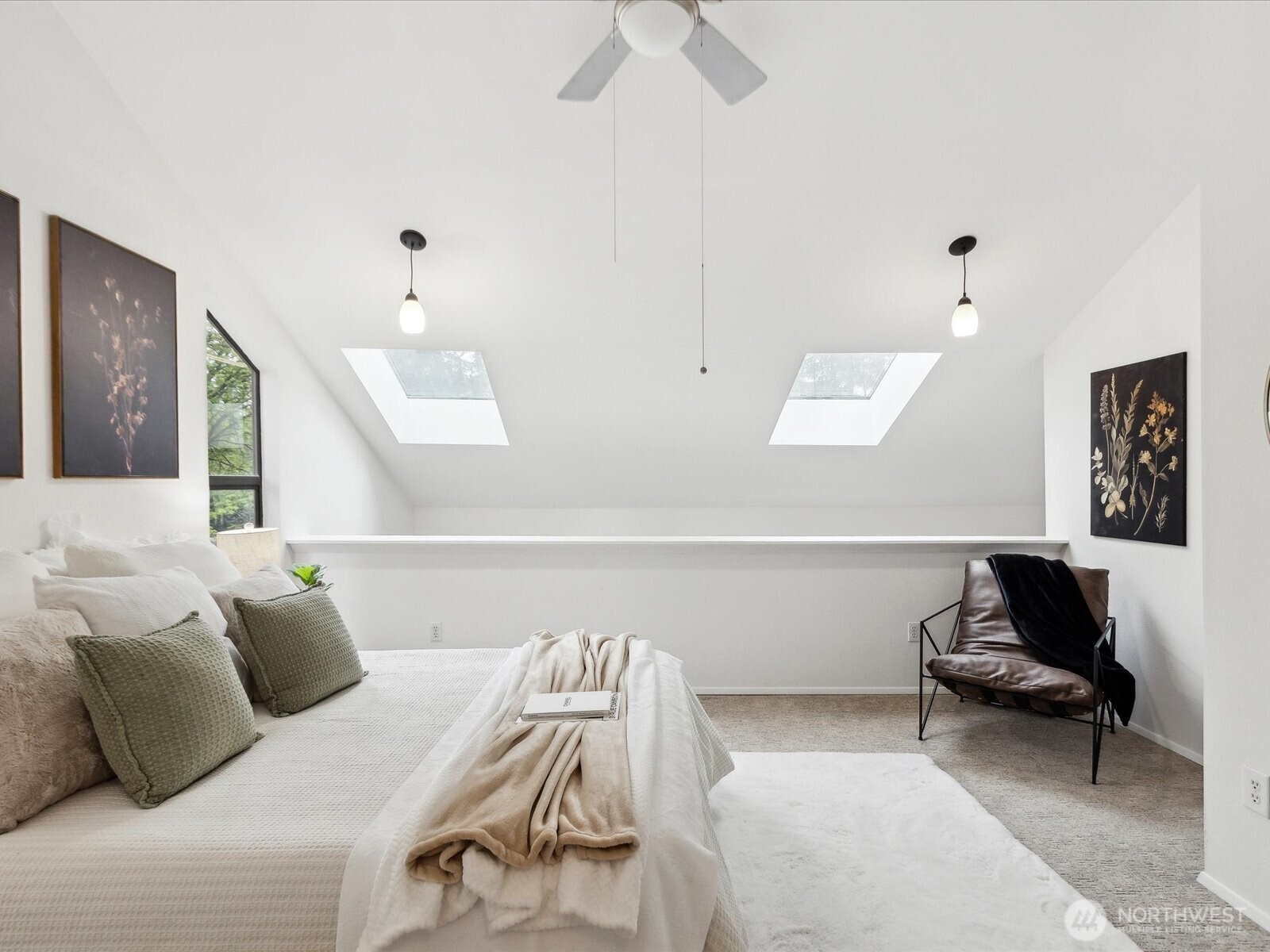 3506 108th Place Northeast, Unit 2 Bellevue, WA 98004 - Photo 25 of 39 a bedroom with a bed and a chandelier