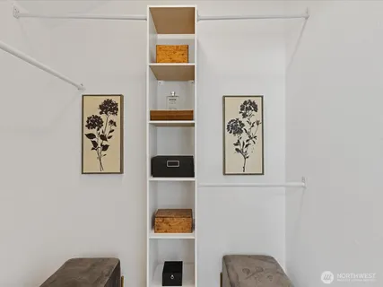 a bathroom with a granite countertop sink mirror vanity and toilet
