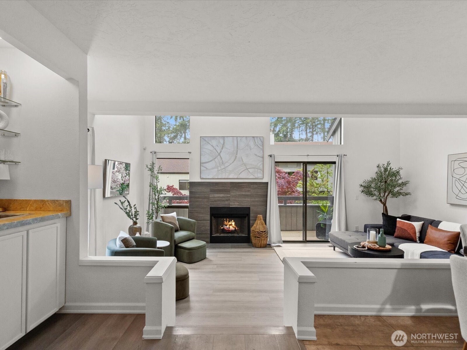 3506 108th Place Northeast, Unit 2 Bellevue, WA 98004 - Photo 3 of 39 a living room with furniture and a fireplace