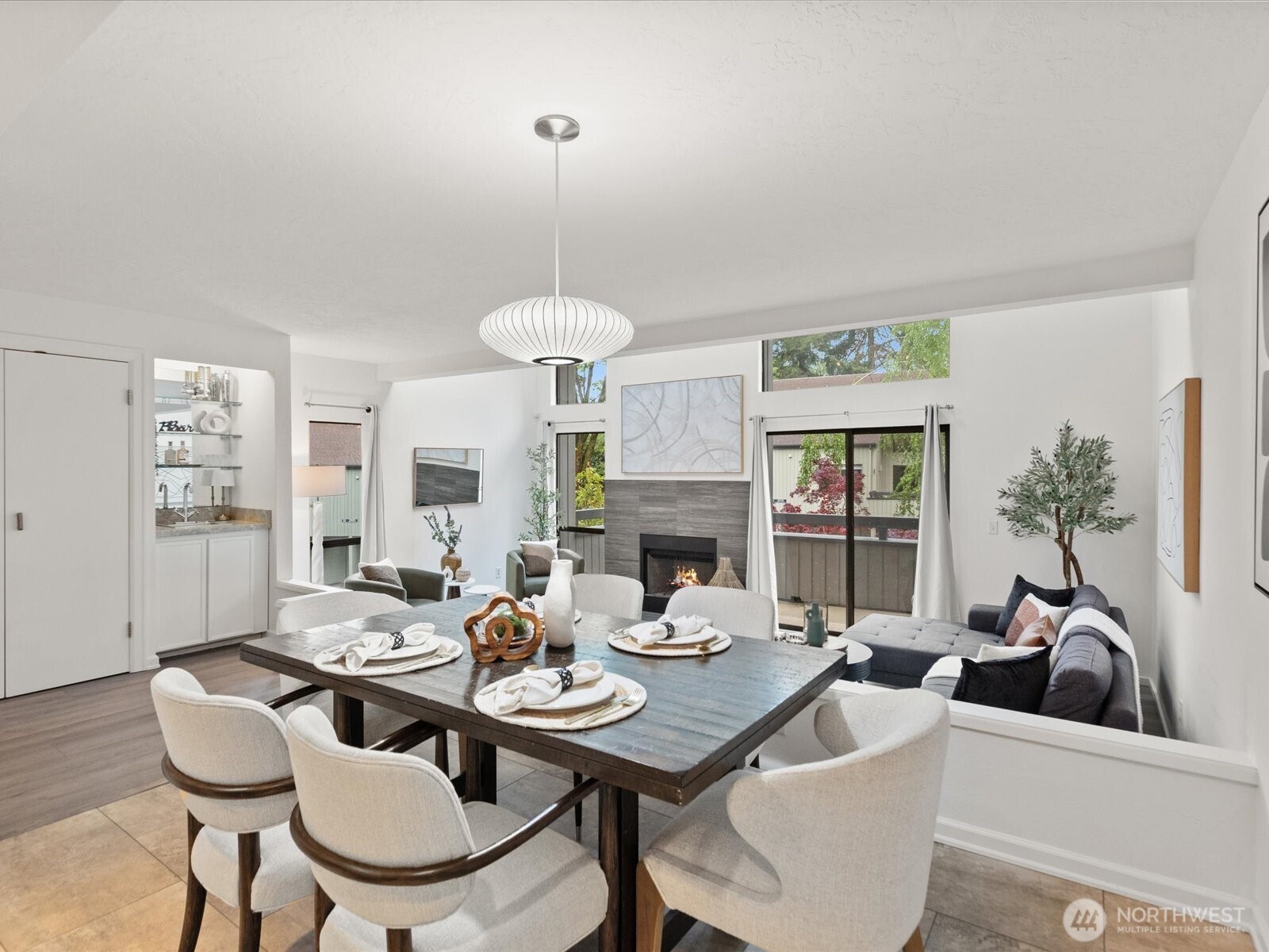 3506 108th Place Northeast, Unit 2 Bellevue, WA 98004 - Photo 7 of 39 a view of a dining room with furniture window and wooden floor