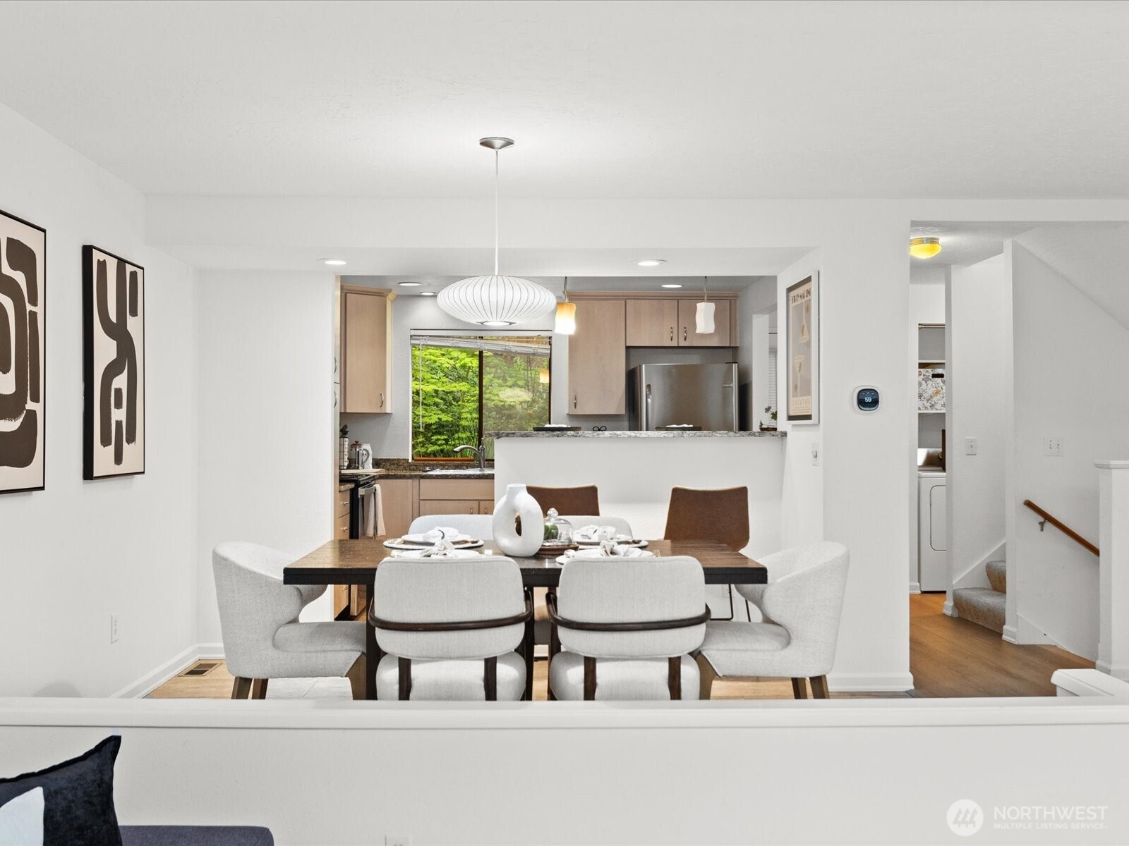 3506 108th Place Northeast, Unit 2 Bellevue, WA 98004 - Photo 9 of 39 a living room with furniture and a large window